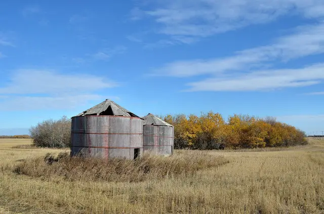 Old granaries in a stubble field