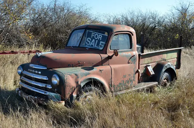 Old Dodge truck with a For Sale sign
